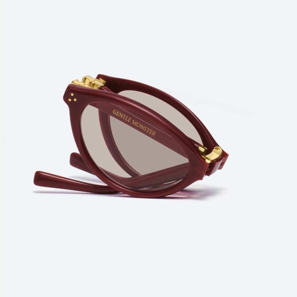 GENTLE MONSTER Burgundy Folding Sunglasses with Gold Accents